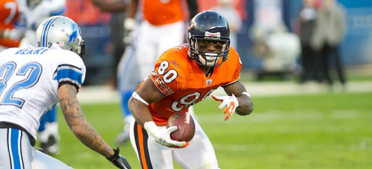 Chicago Bears orange alternate jersey featuring the iconic wishbone “C” helmet — symbol of tradition from 1962 to the present.