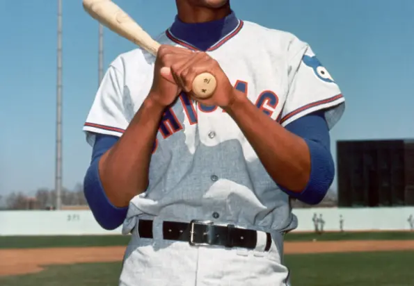 Chicago Cubs Jerseys 6 1940s–1960s Chicago Cubs player wearing a gray jersey with red-and-blue ‘CHICAGO’ script and the smiling ‘Happy Cub’ logo patch on the sleeve
