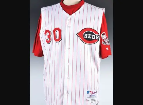 1990s–2000s Cincinnati Reds sleeveless white jersey with red pinstripes, red undershirt, black-trimmed wishbone ‘C’ logo, and player number 30 on the chest