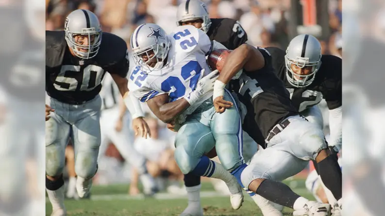 Dallas Cowboys Jerseys 1 Dallas Cowboys running back wearing the white home uniform with navy numbers and silver pants during the team’s dominant 1990s Super Bowl era.