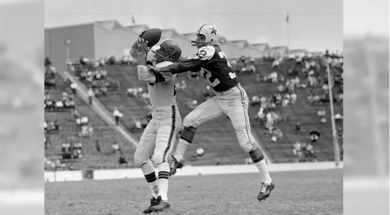 Dallas Cowboys Jerseys 6 Dallas Cowboys player wearing the original royal blue uniform and white helmet with a blue star during the team’s early 1960s debut season.