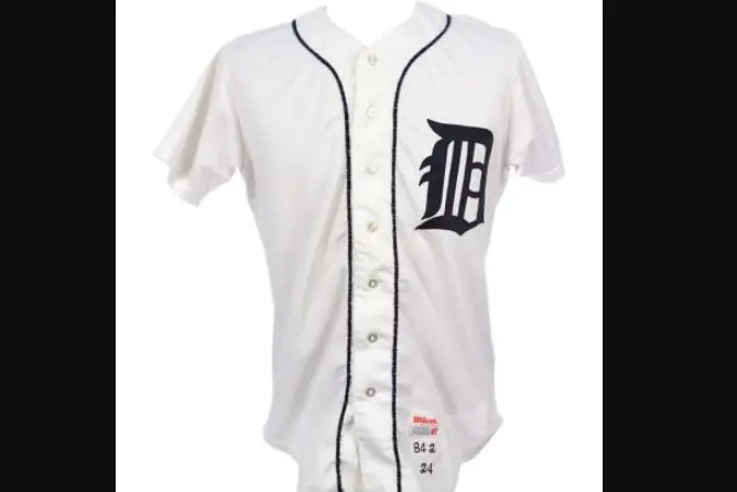 Detroit Tigers jersey from 1960–1993 featuring the classic white button-down design with navy piping and the iconic Old English ‘D’ on the left chest, symbolizing the team’s long-standing tradition through the Al Kaline and 1968–1984 championship eras