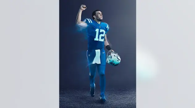 Indianapolis Colts player wearing number 12 in the 2020–present blue home uniform, celebrating the team's return to tradition