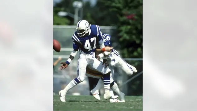 Indianapolis Colts player wearing number 47 blue jersey and white pants during the 1984–2003 era after the move from Baltimore