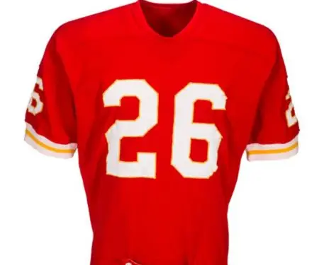 1960s Kansas City Chiefs red and gold uniform with arrowhead helmet logo, classic AFL era