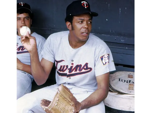 1960s Minnesota Twins gray jersey with red script ‘Twins’ outlined in navy and a ‘TC’ cap logo