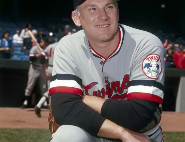 1970s Minnesota Twins gray pullover jersey with red script ‘Minnesota’ outlined in navy and navy-red sleeve stripes