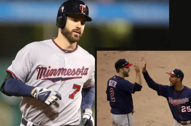 1980s–2000s Minnesota Twins gray and navy jerseys with red script ‘Minnesota’ outlined in navy, worn with ‘TC’ logo caps