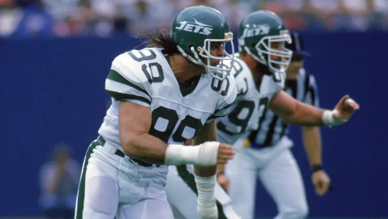 New York Jets player wearing number 99 in the 1978–1989 Kelly Green uniform during the 'Sack Exchange' era