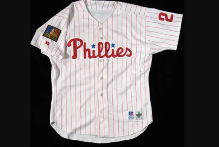 Philadelphia Phillies home jersey from the 1970–1991 era featuring red pinstripes, maroon ‘Phillies’ script with blue stars, and number 2 on the sleeve