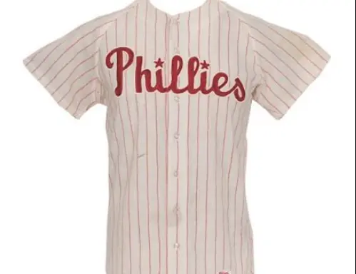 Philadelphia Phillies vintage home jersey with red pinstripes and script ‘Phillies’ in red outlined with blue, representing the classic 1950s design