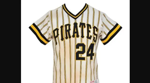 1970s–1980s Pittsburgh Pirates pullover jersey in white with black and gold pinstripes, featuring large black ‘PIRATES’ lettering and number 24, representing the team’s iconic ‘Bumblebee’ era look