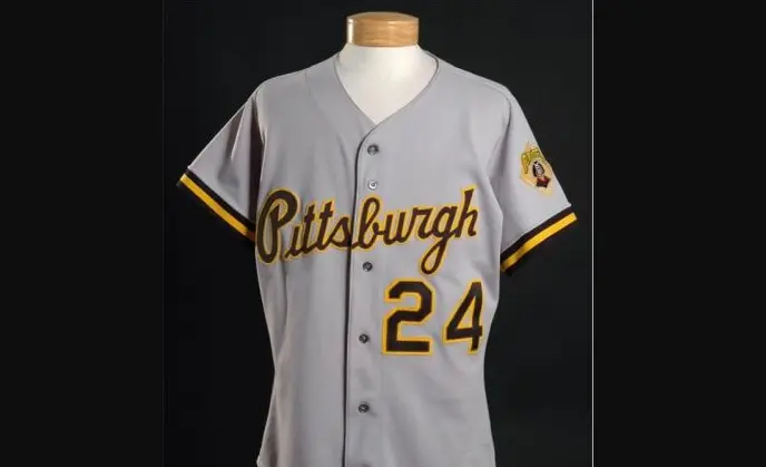 1990s–2000s Pittsburgh Pirates gray button-down jersey featuring gold script ‘Pittsburgh’ across the chest and number 24, accented with black and gold sleeve trim and a Pirates patch on the shoulder