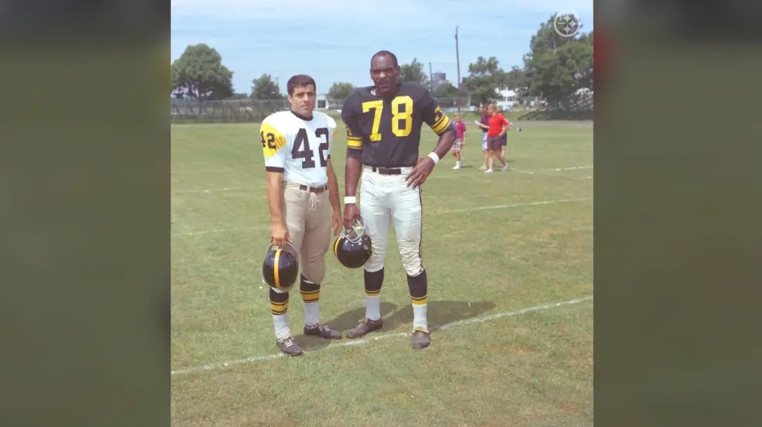 Pittsburgh Steelers players wearing the black and white ‘Batman’ uniforms with gold triangle design in the 1960s