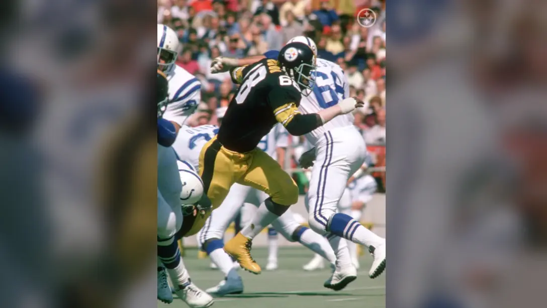 Pittsburgh Steelers player in black and gold uniform during a game in the 1970s dynasty era