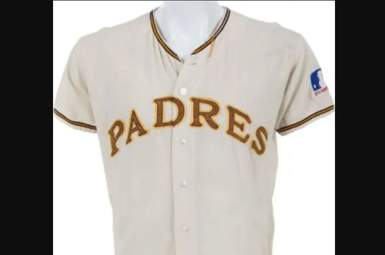 1970s San Diego Padres cream jersey featuring brown and gold ‘PADRES’ lettering, representing the team’s original brown-and-gold ‘Taco Bell’ era